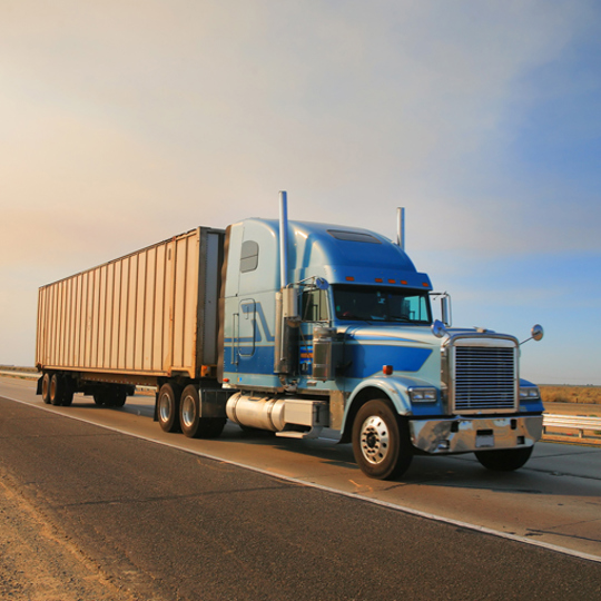 Securing chemical cargo with strapping and dunnage bags for safe truck transport