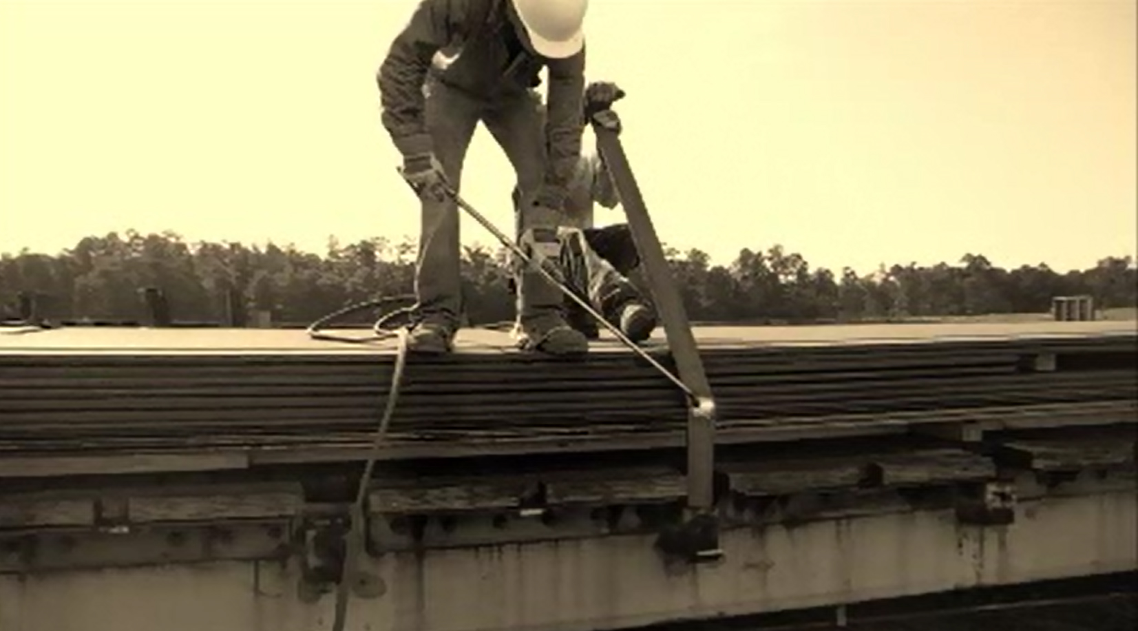 Worker on top of a rail car