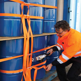 Lashing of a container filled with drums with CornerLash tensioned using a pneumatic tensioner. 